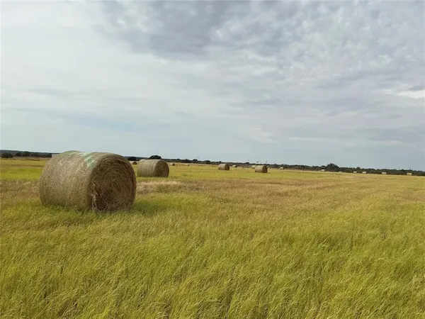 a view of a swimming pool and an outdoor seating