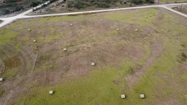 a view of a lake with a car parked