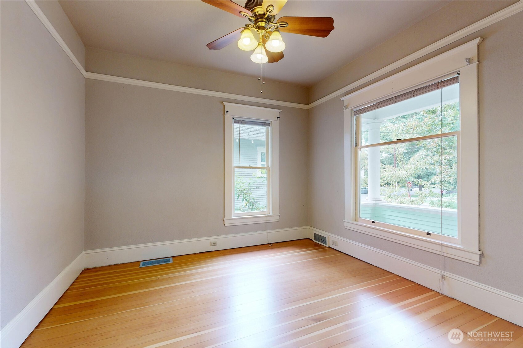 308 Newell Street Walla Walla, WA 99362 - Photo 22 of 40 a view of an empty room with window and wooden floor