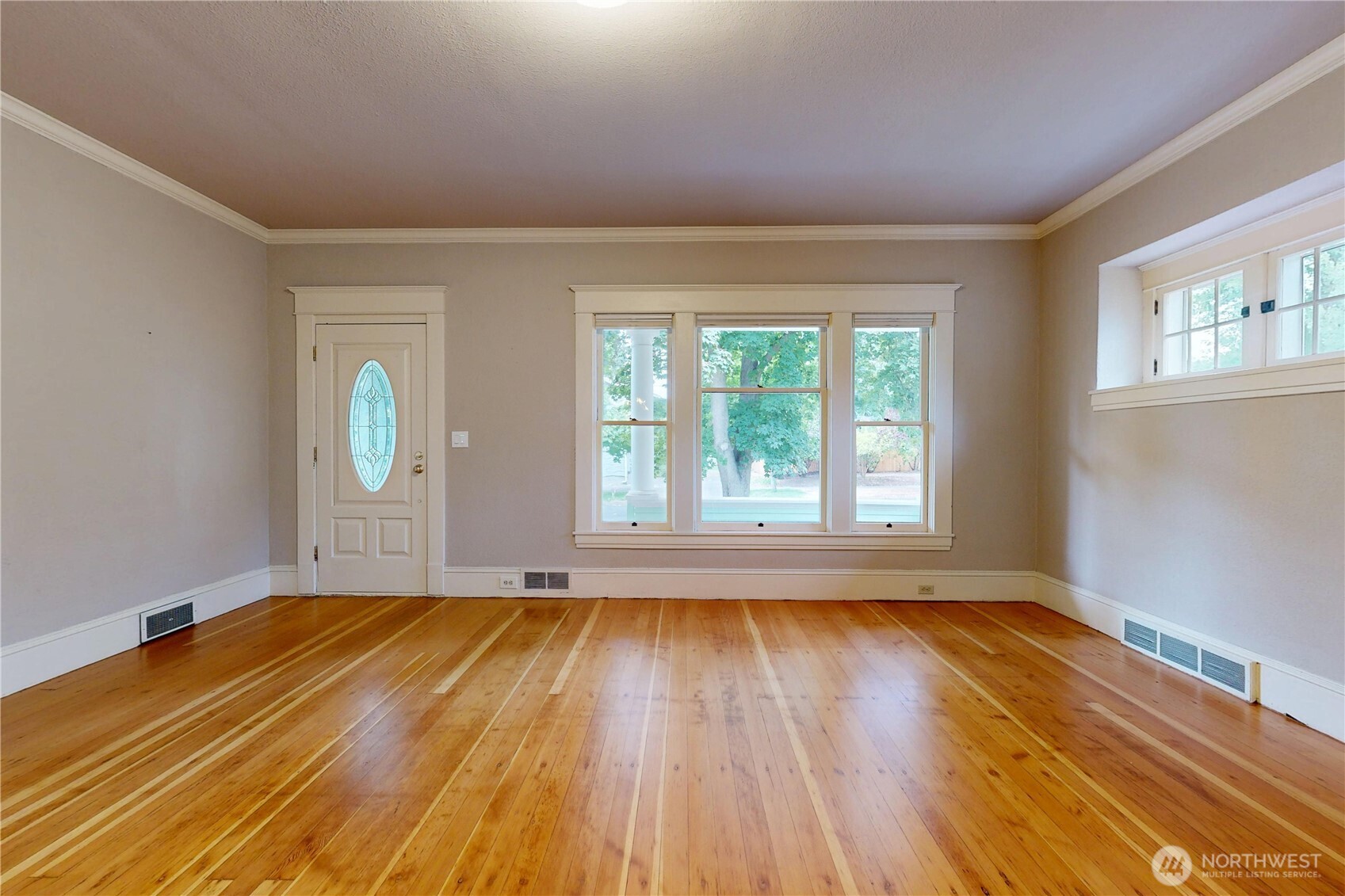 308 Newell Street Walla Walla, WA 99362 - Photo 9 of 40 a view of empty room with wooden floor and fan