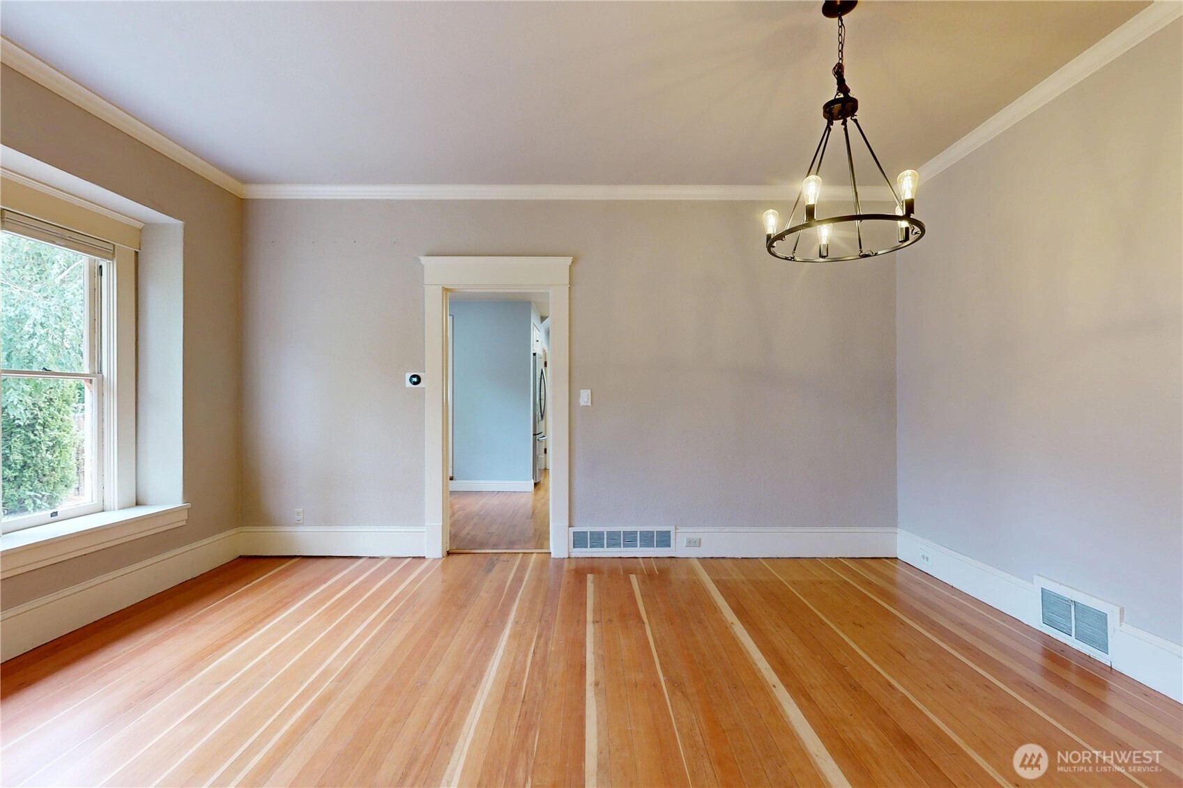 308 Newell Street Walla Walla, WA 99362 - Photo 10 of 40 a view of empty room with wooden floor and window