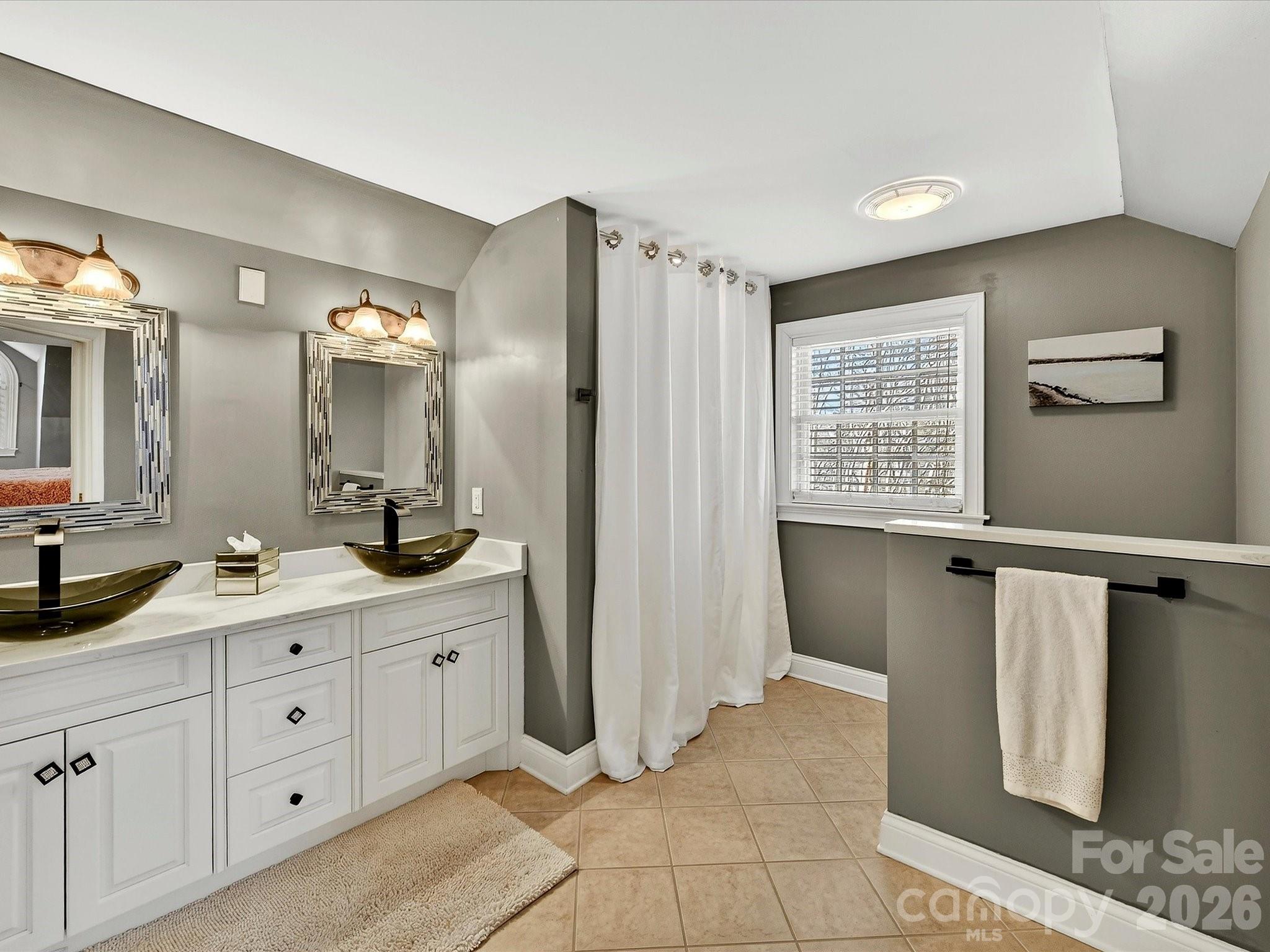 1779 8th St Drive Northwest Hickory, NC 28601 - Photo 23 of 36 a spacious bathroom with a double vanity sink a mirror and a shower