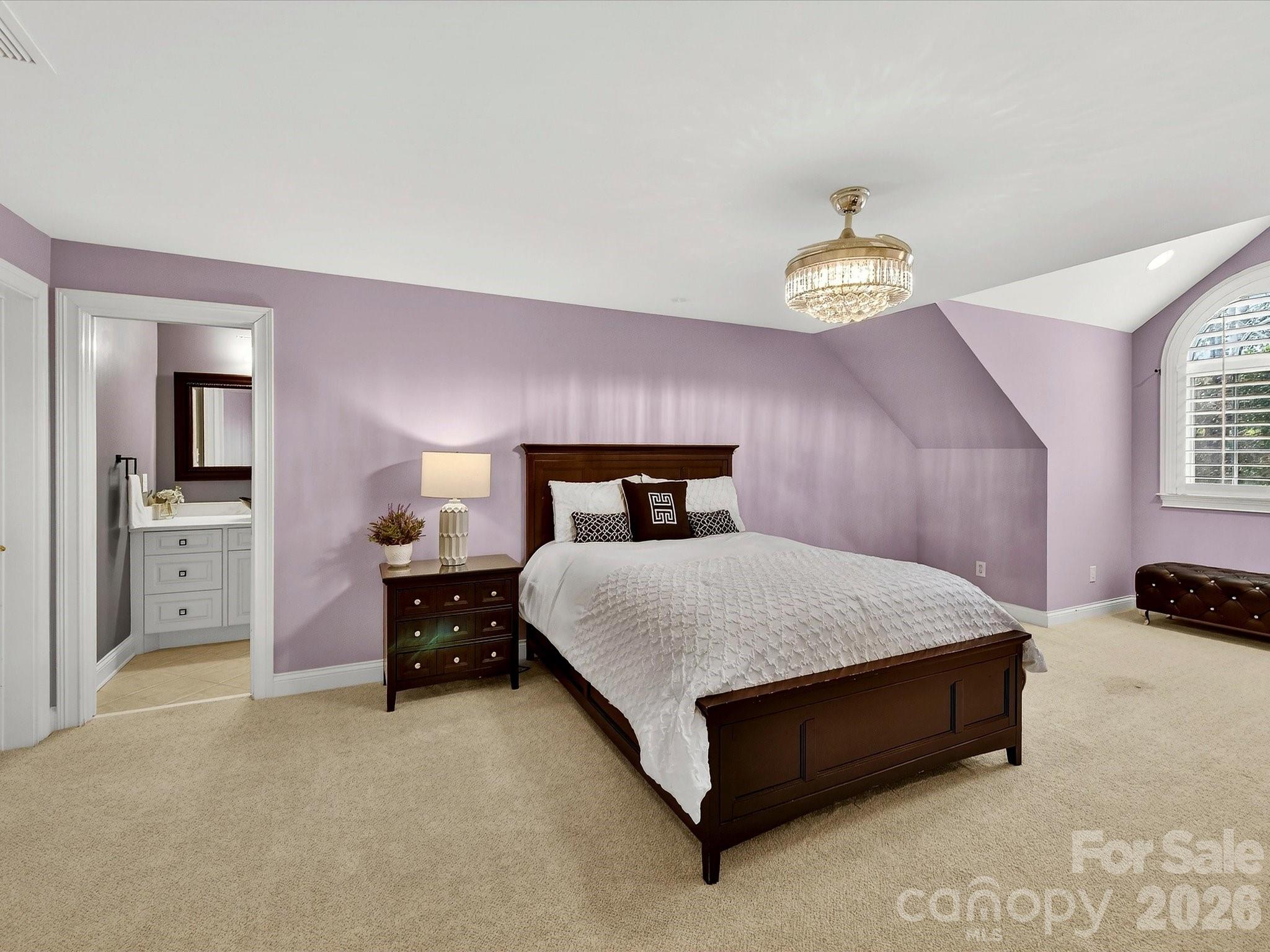 1779 8th St Drive Northwest Hickory, NC 28601 - Photo 24 of 36 a bedroom with a bed and a chandelier