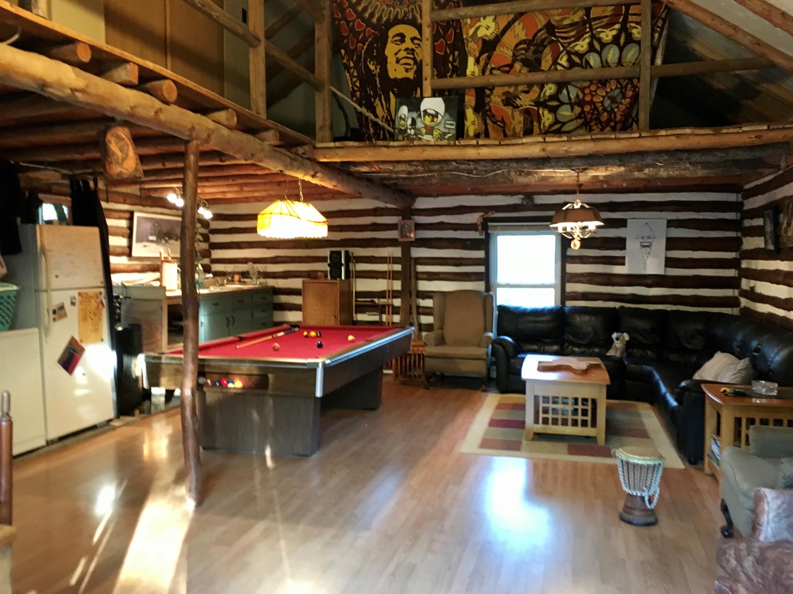 3772 North Fork Road Elliston, VA 24087 - Photo 22 of 42 a room with wooden furniture and gym equipment