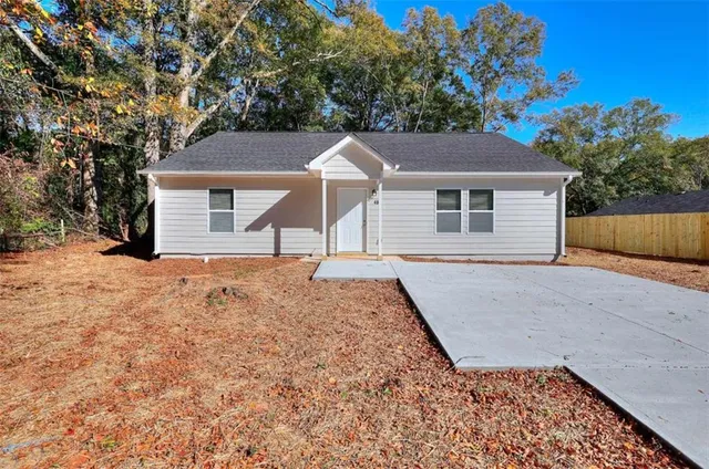 front view of a house with a yard