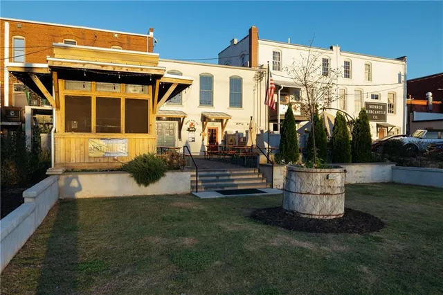 a front view of a building with garden