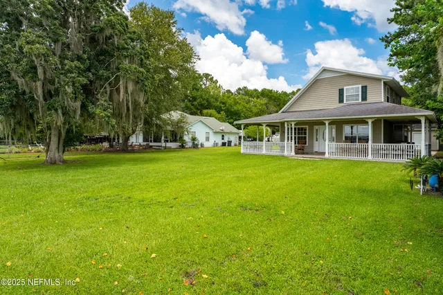 a view of a house with a big yard