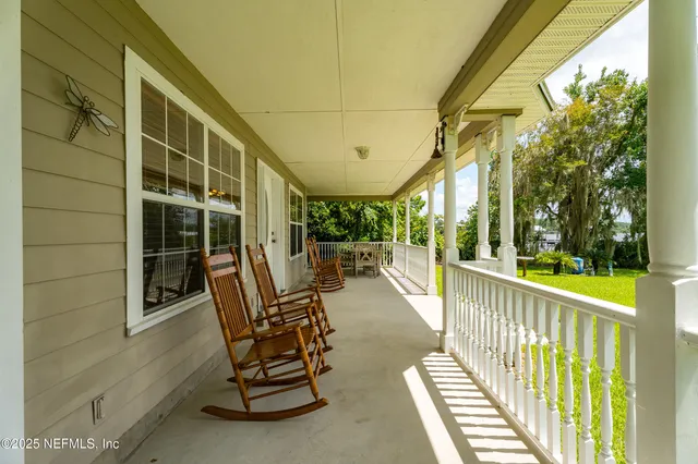 a view of swimming pool with seating area