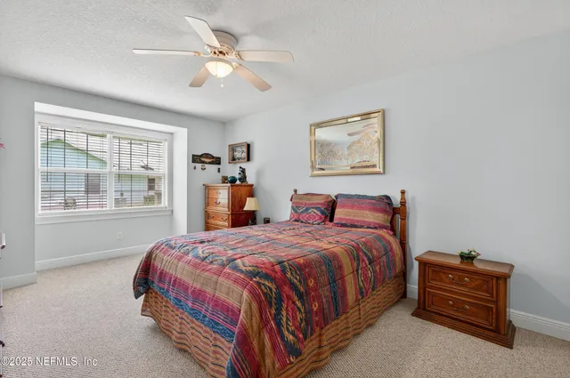a bathroom with a toilet a sink and a mirror