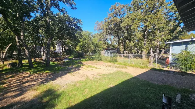 a view of a yard with swimming pool
