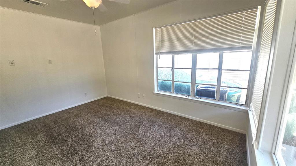 2621 North Locust Street Denton, TX 76209 - Photo 8 of 26 an empty room with a window