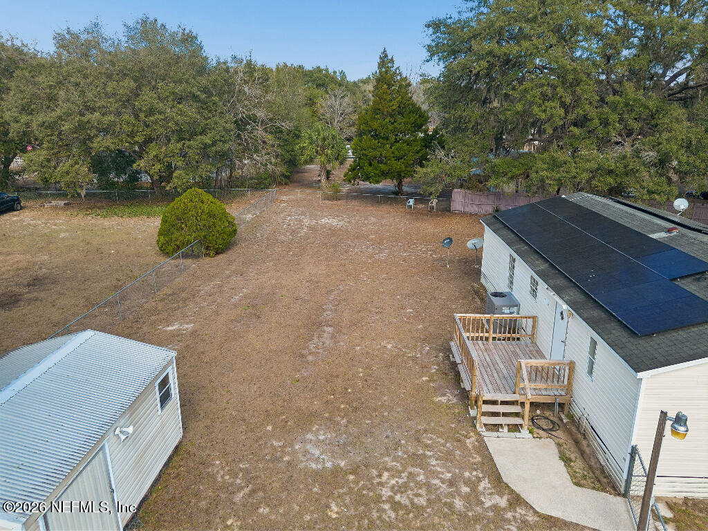 101 Ridgewood Avenue Interlachen, FL 32148 - Photo 23 of 25 an aerial view of a house with yard swimming pool and outdoor seating