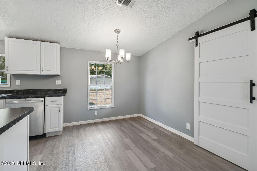 101 Ridgewood Avenue Interlachen, FL 32148 - Photo 6 of 25 a view of a kitchen and utility room