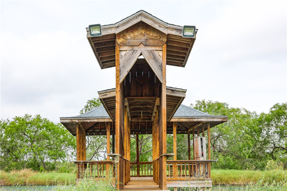 120 Tbd County Road Alice, TX 78332 - Photo 3 of 8 a view of a pathway of a house with wooden fence