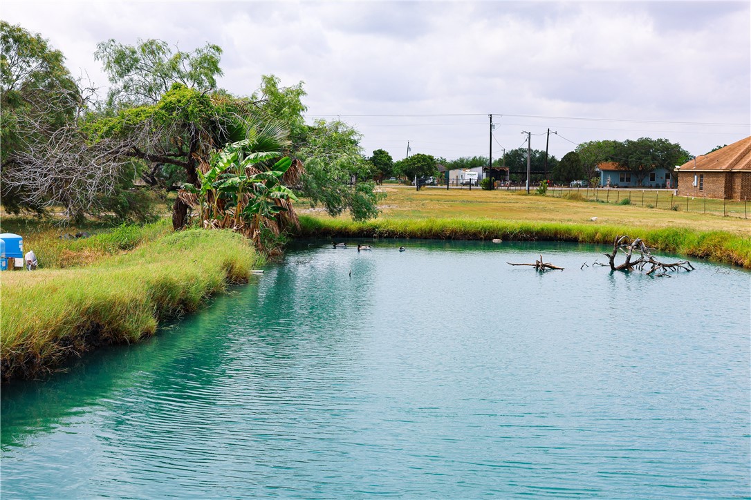 120 Tbd County Road Alice, TX 78332 - Photo 6 of 8 a view of a lake with houses