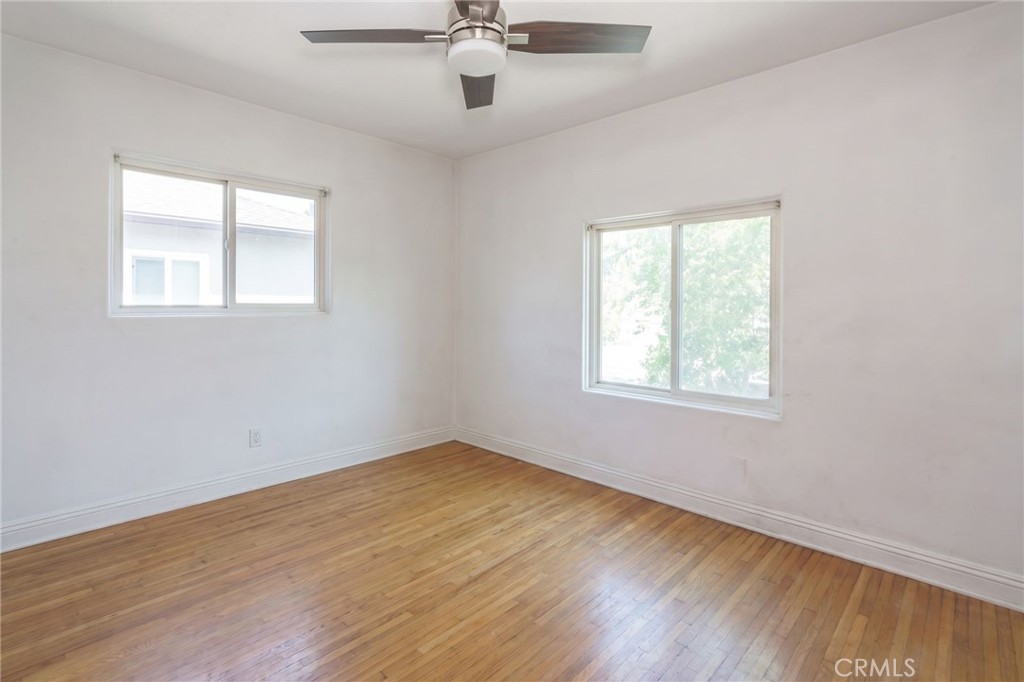 346 West School Street Compton, CA 90220 - Photo 21 of 29 wooden floor in an empty room with a window