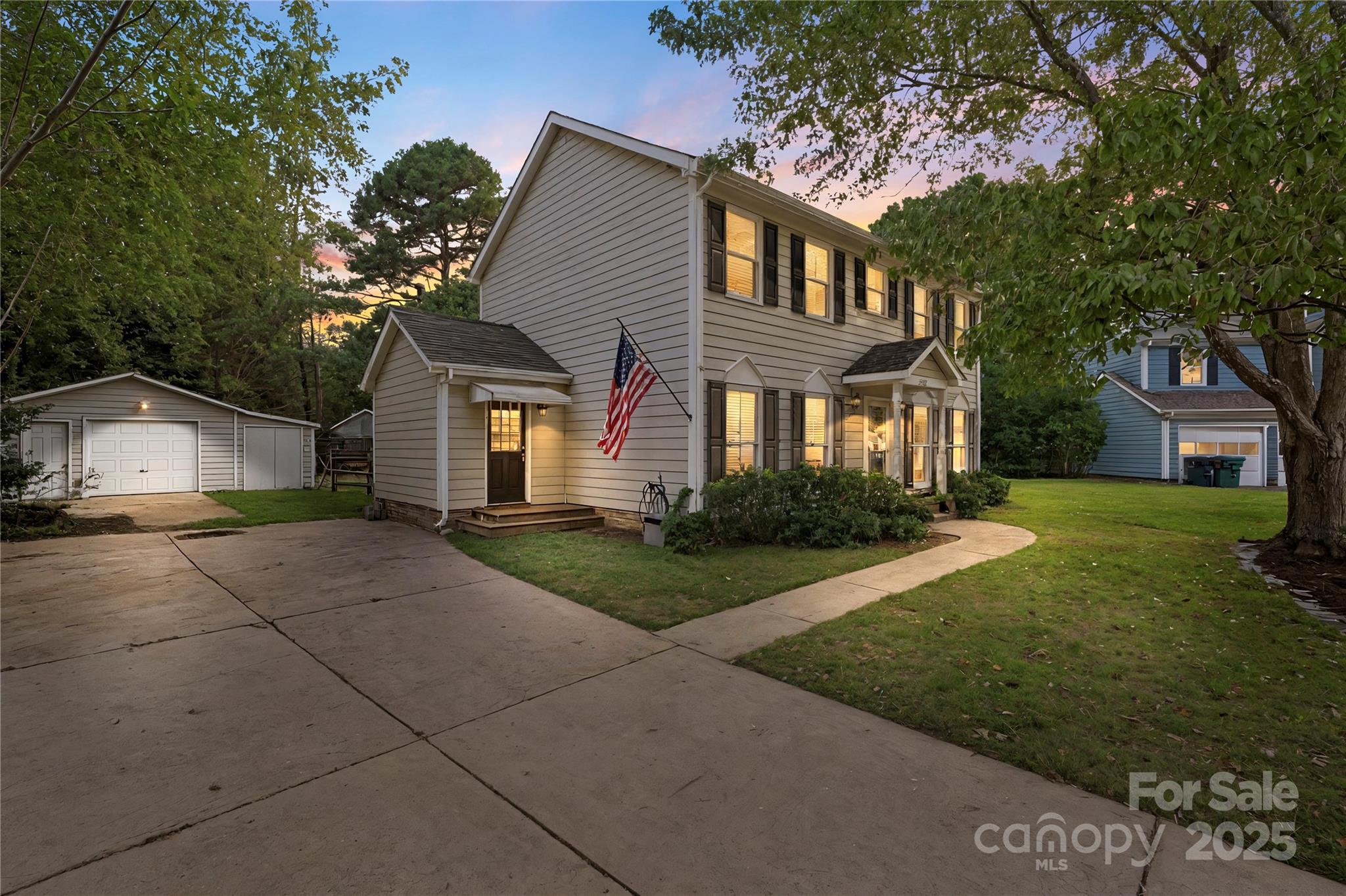 2519 Fitzpatrick Lane Matthews, NC 28105 - Photo 1 of 46 a front view of a house with a yard and a garage