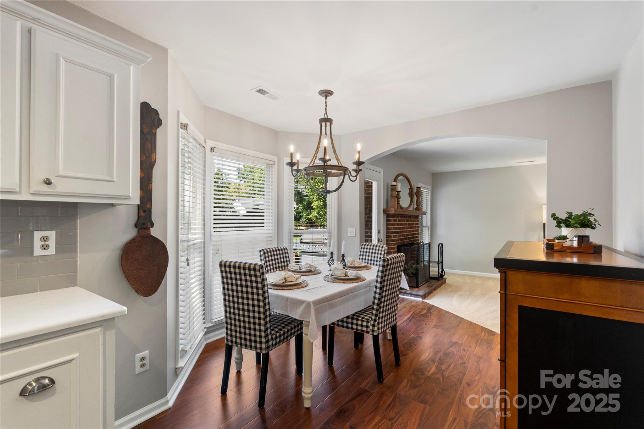 2519 Fitzpatrick Lane Matthews, NC 28105 - Photo 16 of 46 a view of a dining room with furniture window and wooden floor
