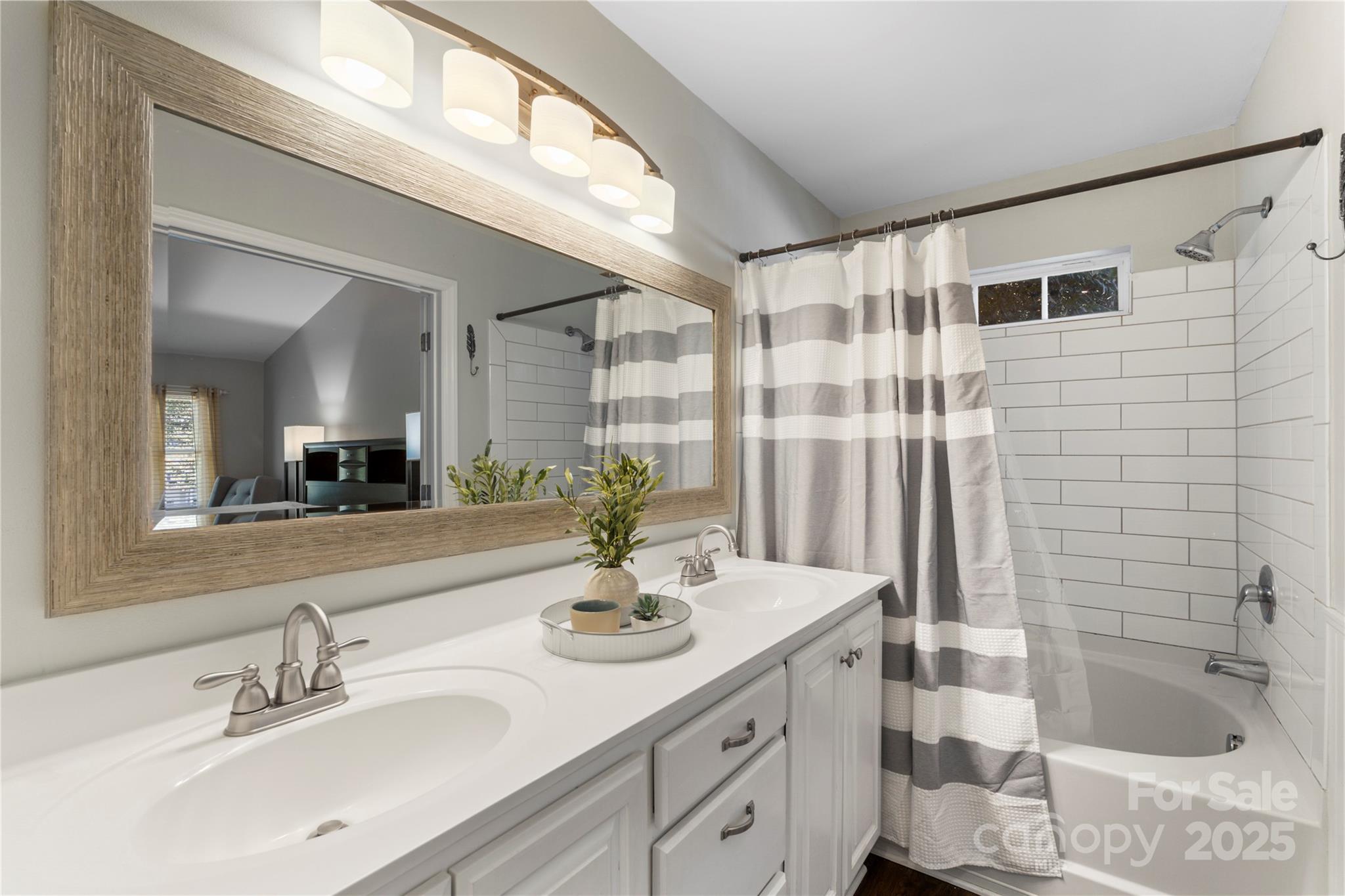 2519 Fitzpatrick Lane Matthews, NC 28105 - Photo 26 of 46 a bathroom with a sink and a mirror