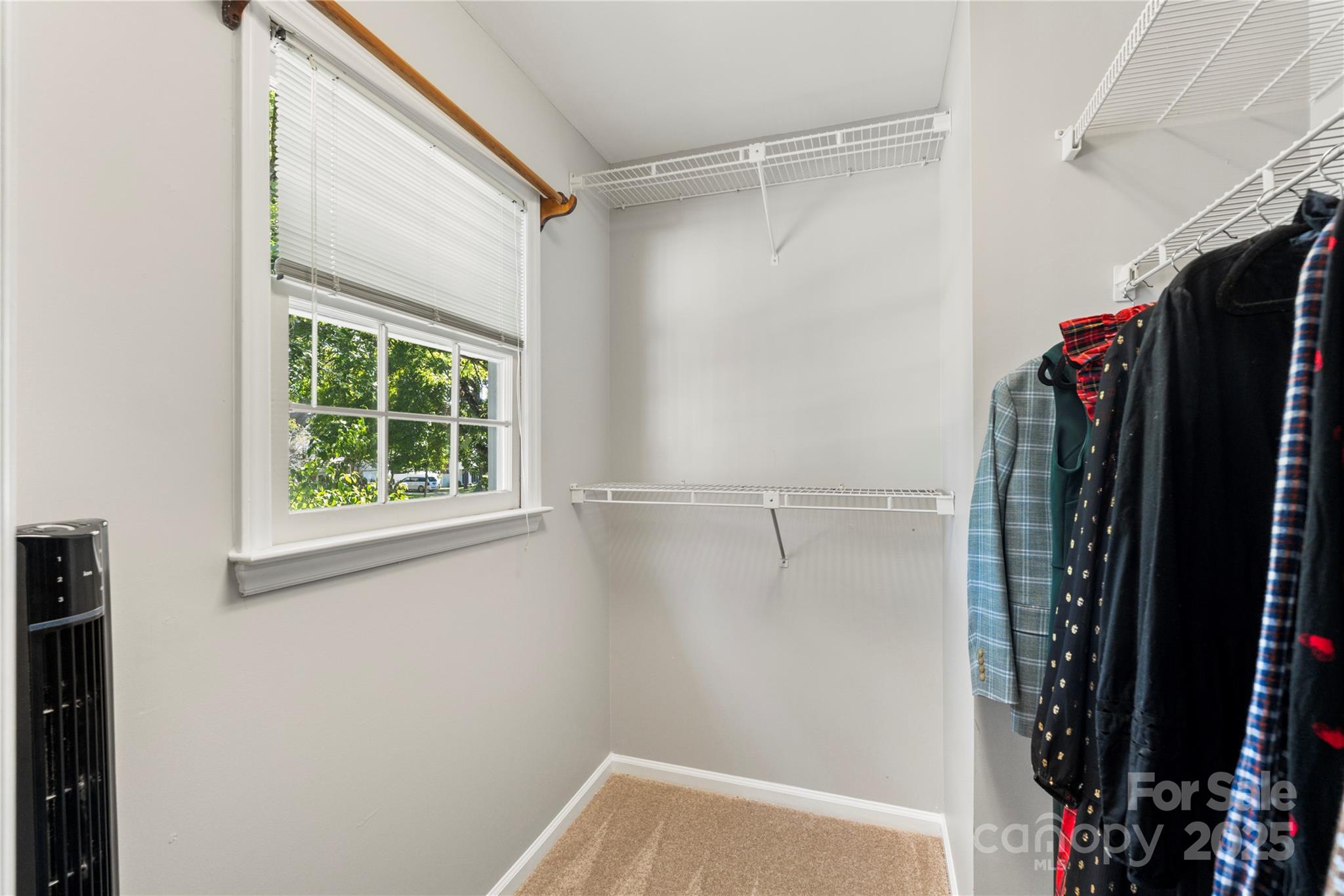 2519 Fitzpatrick Lane Matthews, NC 28105 - Photo 27 of 46 a view of walk in closet with clothes and shoes