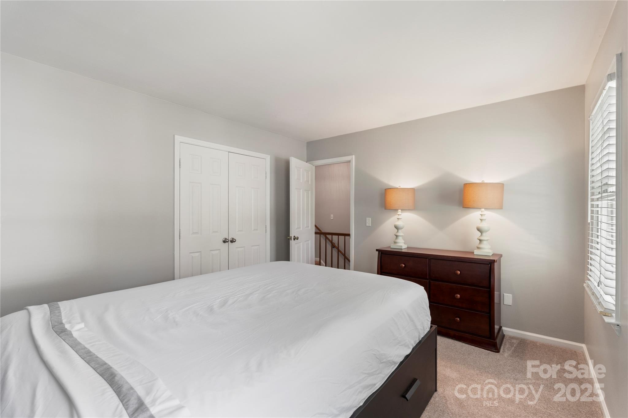 2519 Fitzpatrick Lane Matthews, NC 28105 - Photo 30 of 46 a bedroom with a bed and a dresser