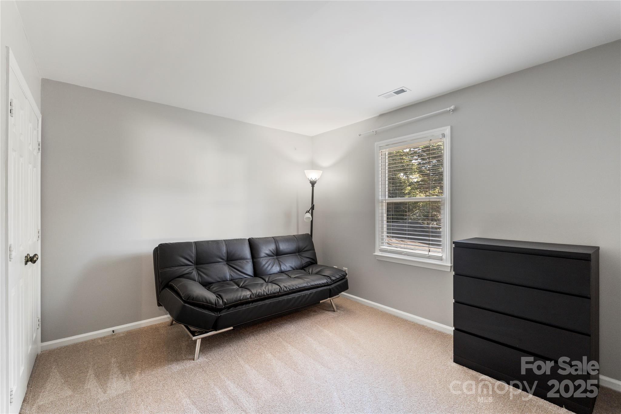 2519 Fitzpatrick Lane Matthews, NC 28105 - Photo 31 of 46 a living room with furniture and a window