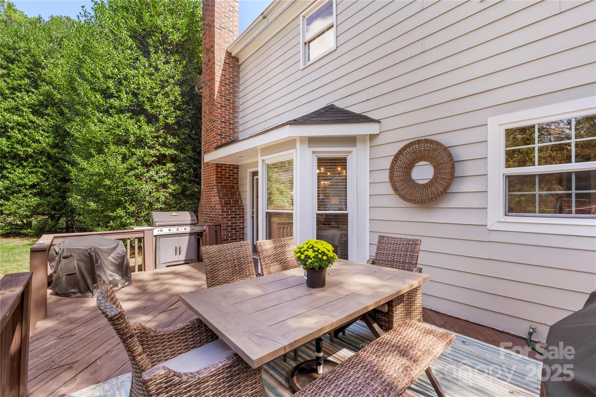 2519 Fitzpatrick Lane Matthews, NC 28105 - Photo 36 of 46 a view of a house with a chairs in patio