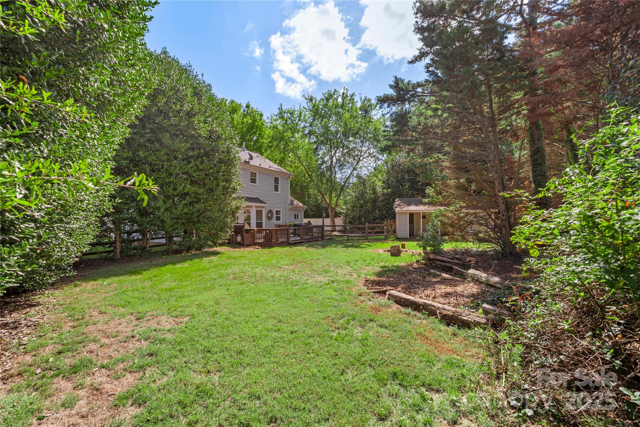 2519 Fitzpatrick Lane Matthews, NC 28105 - Photo 39 of 46 a backyard of a house with lots of green space