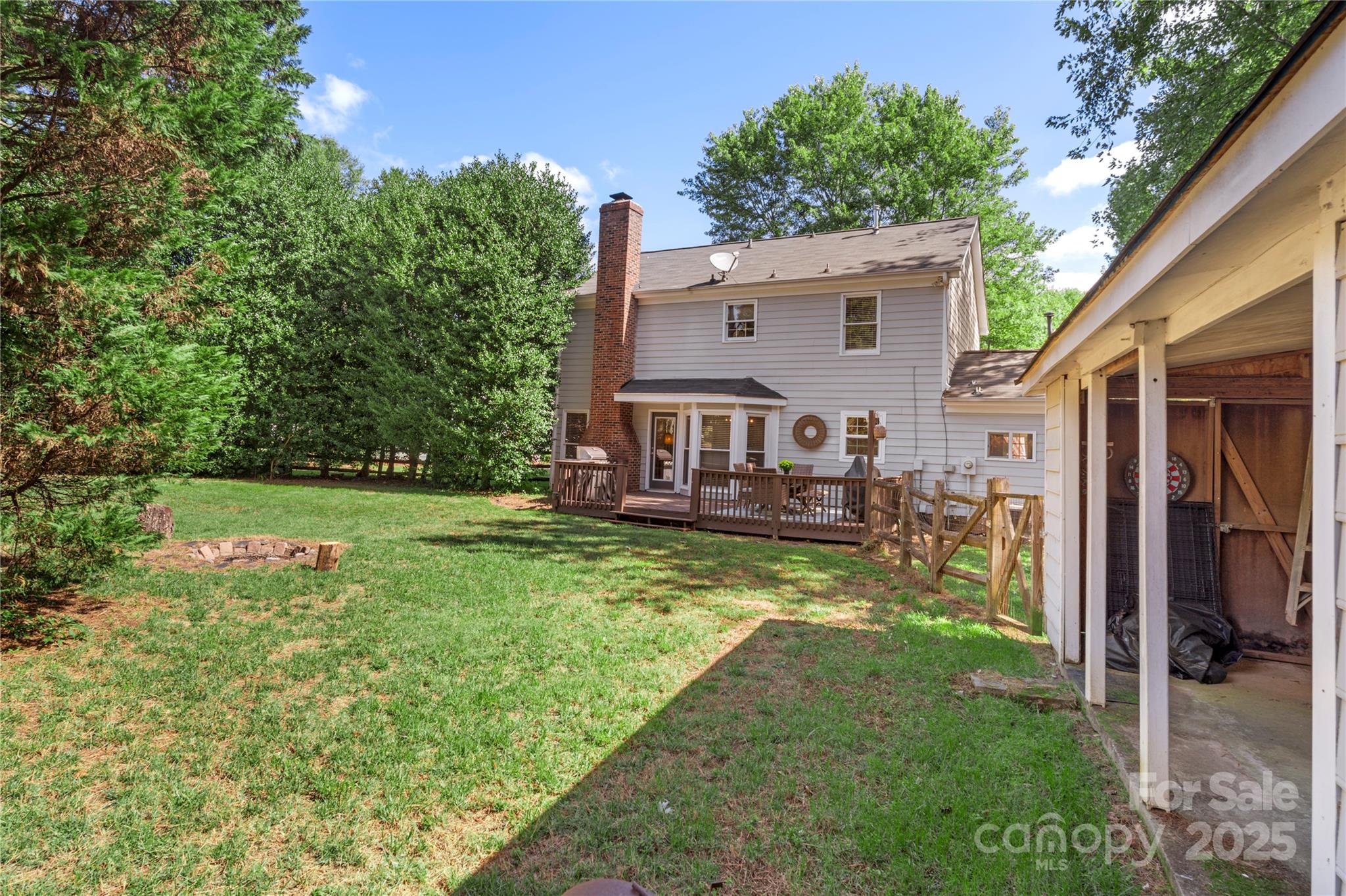 2519 Fitzpatrick Lane Matthews, NC 28105 - Photo 40 of 46 a view of a house with backyard and a tree