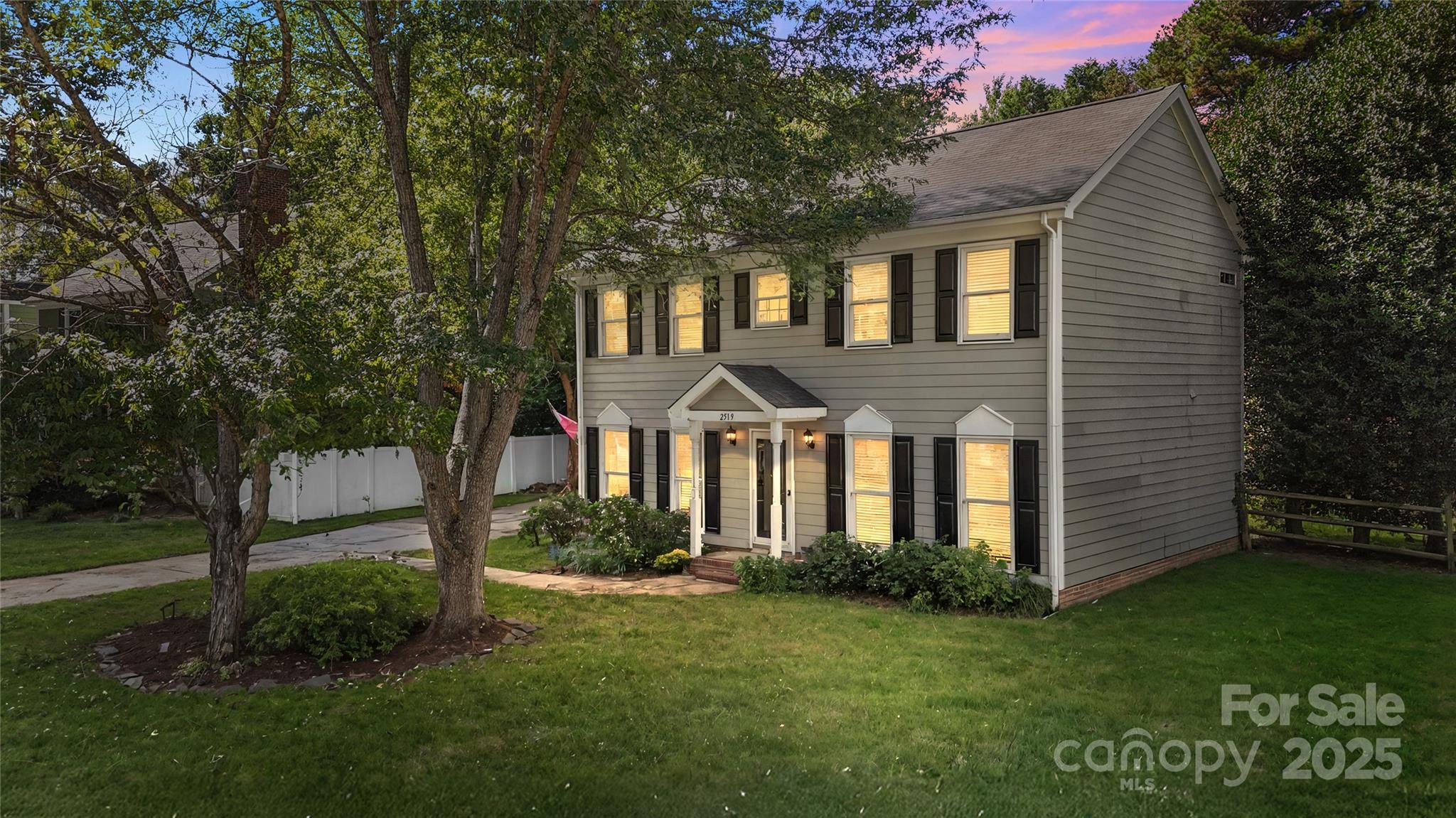 2519 Fitzpatrick Lane Matthews, NC 28105 - Photo 4 of 46 a front view of a house with a garden