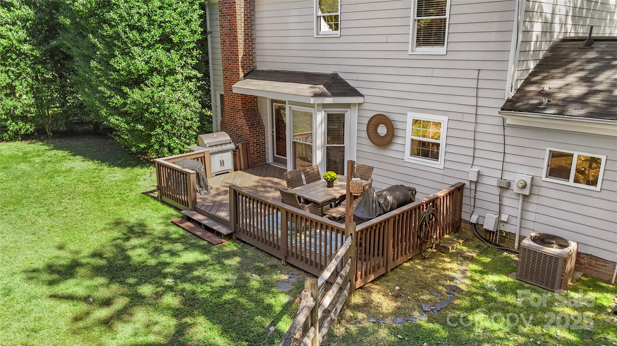 2519 Fitzpatrick Lane Matthews, NC 28105 - Photo 41 of 46 a view of a house with backyard and sitting area