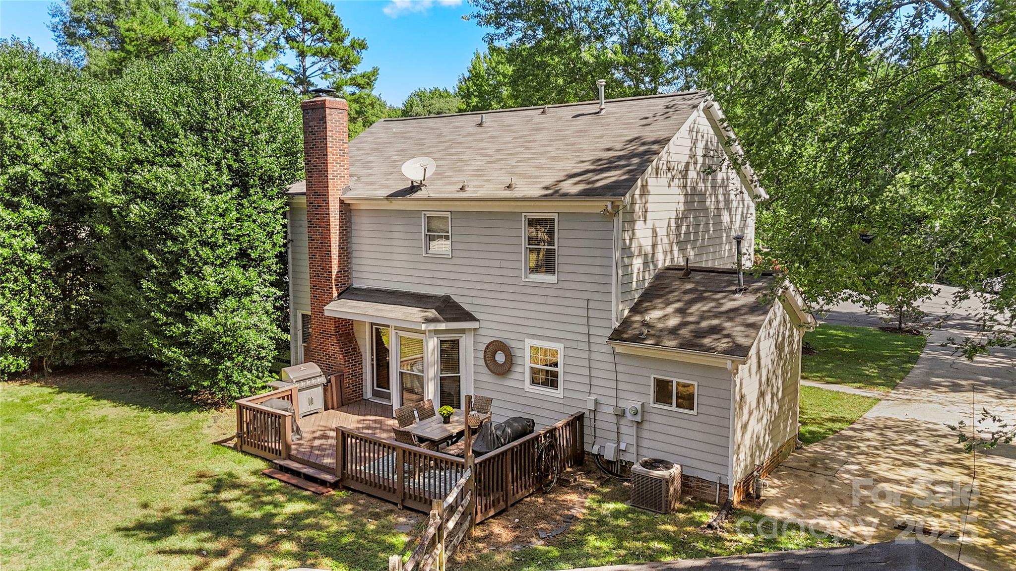 2519 Fitzpatrick Lane Matthews, NC 28105 - Photo 42 of 46 a view of house with a yard and seating area