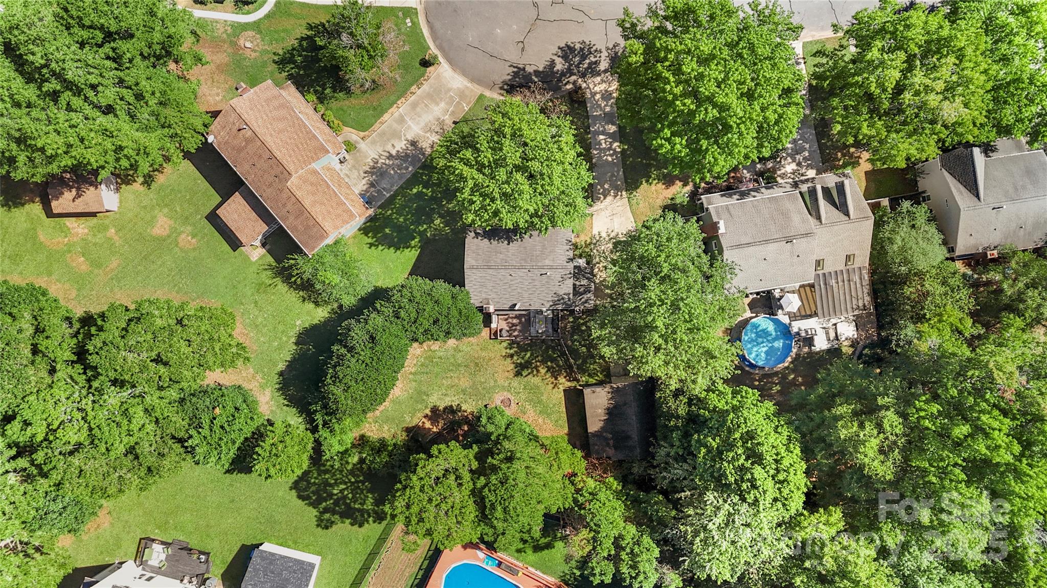 2519 Fitzpatrick Lane Matthews, NC 28105 - Photo 45 of 46 an aerial view of a house with a yard