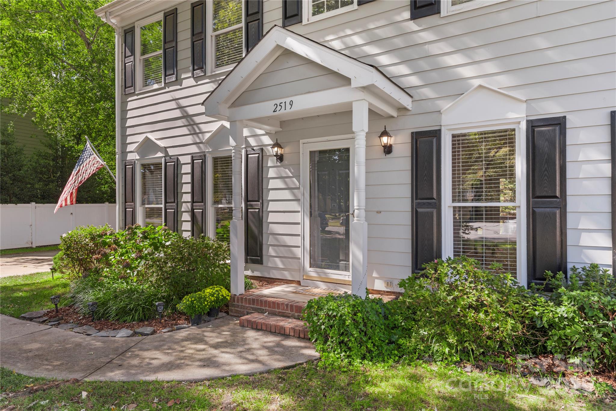 2519 Fitzpatrick Lane Matthews, NC 28105 - Photo 5 of 46 front view of a house with a small yard