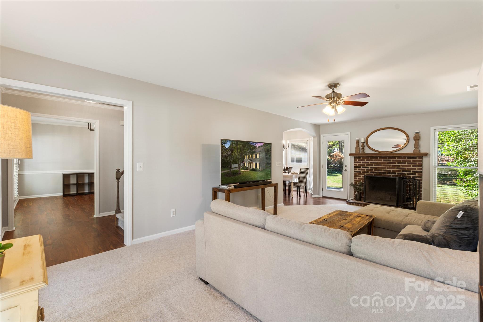 2519 Fitzpatrick Lane Matthews, NC 28105 - Photo 8 of 46 a living room with furniture and a fireplace