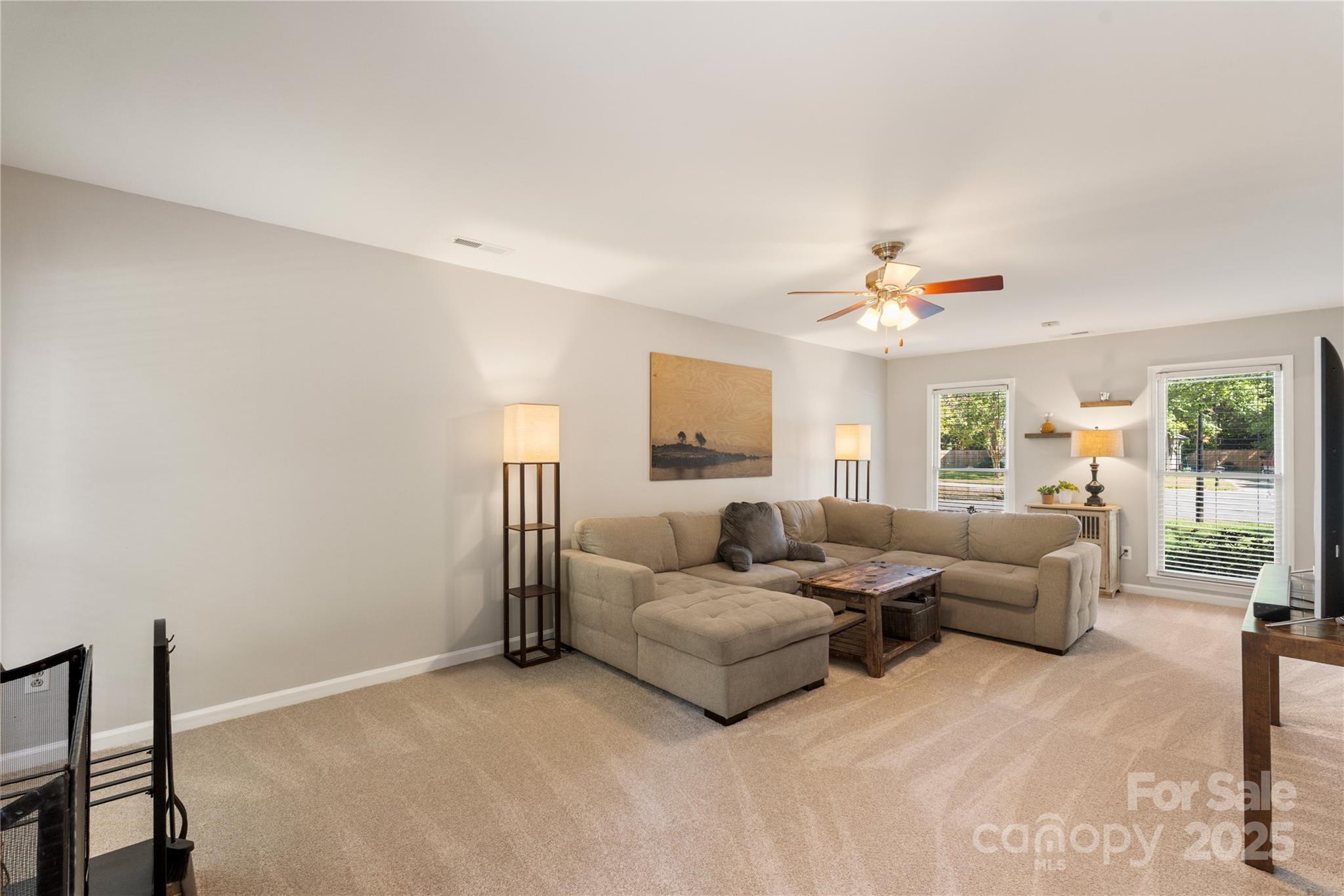 2519 Fitzpatrick Lane Matthews, NC 28105 - Photo 10 of 46 a living room with furniture and a large window