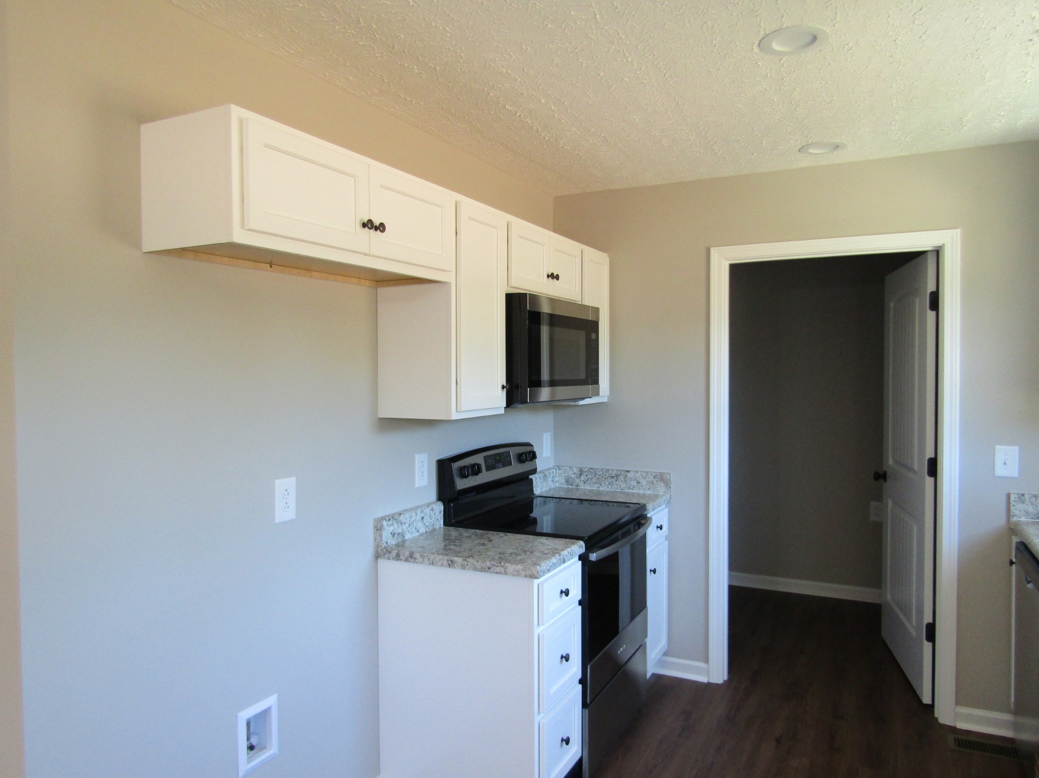 470 Crescent Factory Road Lawrenceburg, TN 38464 - Photo 7 of 15 a kitchen with a microwave and cabinets
