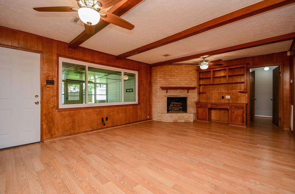 28911 Enchanted Drive Spring, TX 77381 - Photo 5 of 7 a view of an empty room with a window and fireplace