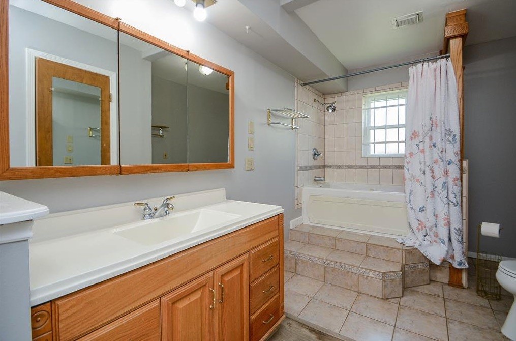 28911 Enchanted Drive Spring, TX 77381 - Photo 6 of 7 a bathroom with a sink and a mirror