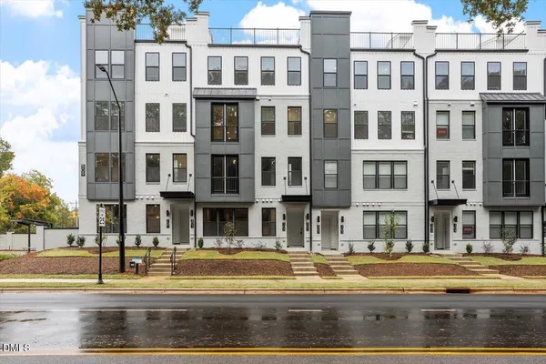 a view of street with a apartment building