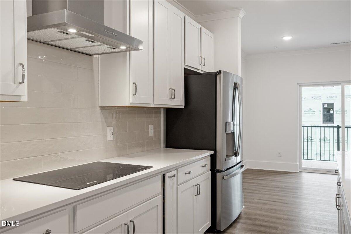 509 Kildaire Farm Road, Unit 302 Cary, NC 27511 - Photo 11 of 30 a kitchen with appliances and cabinets