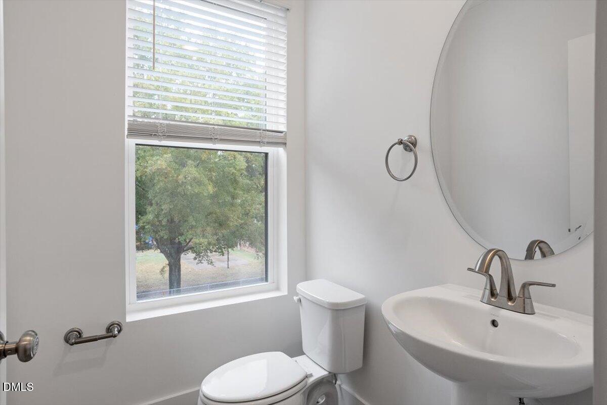 509 Kildaire Farm Road, Unit 302 Cary, NC 27511 - Photo 17 of 30 a bathroom with a sink and a mirror