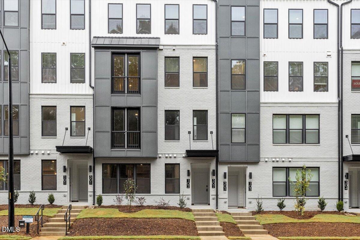 509 Kildaire Farm Road, Unit 302 Cary, NC 27511 - Photo 2 of 30 a front view of a building with a swimming pool