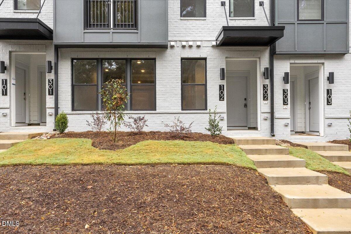 509 Kildaire Farm Road, Unit 302 Cary, NC 27511 - Photo 3 of 30 a view of a house with a swimming pool and sitting area