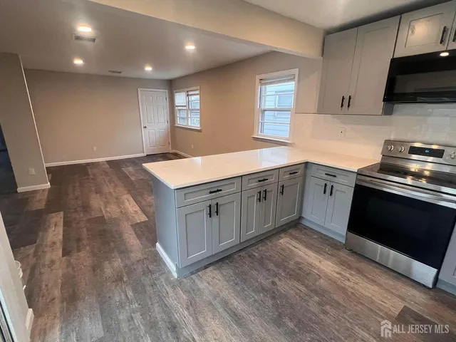 a kitchen with a stove and a sink