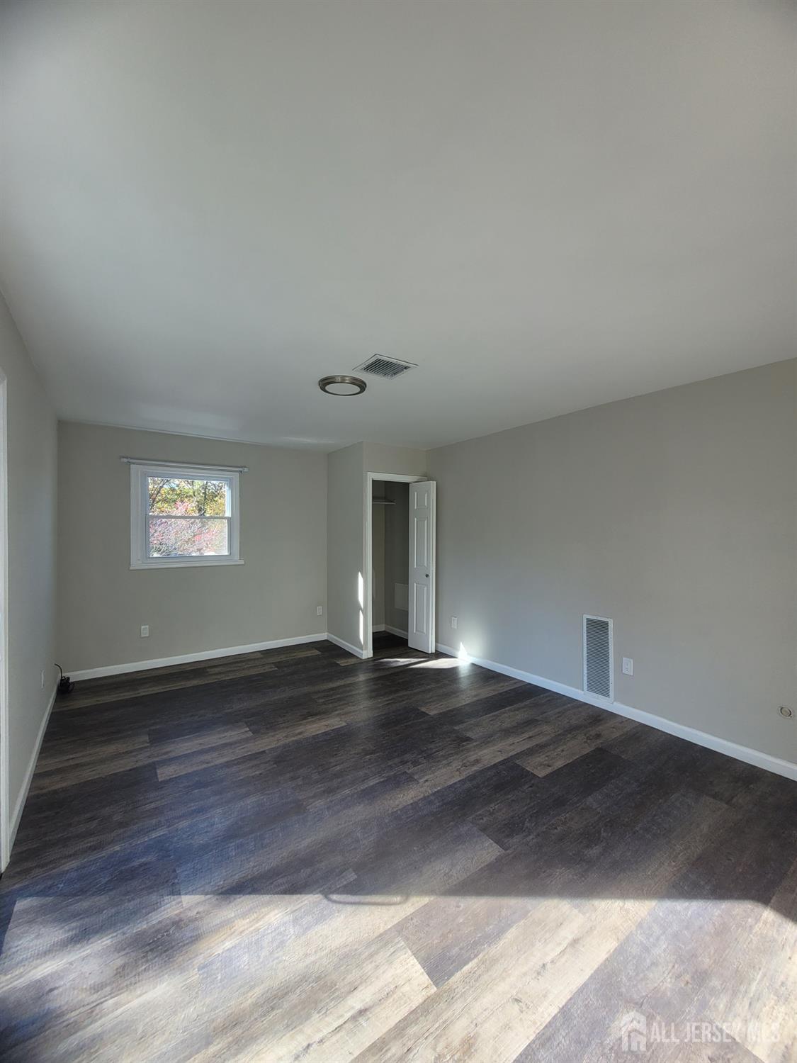 249 Olsen Street, Unit 2 Sayreville, NJ 08879 - Photo 17 of 24 a view of an empty room and window