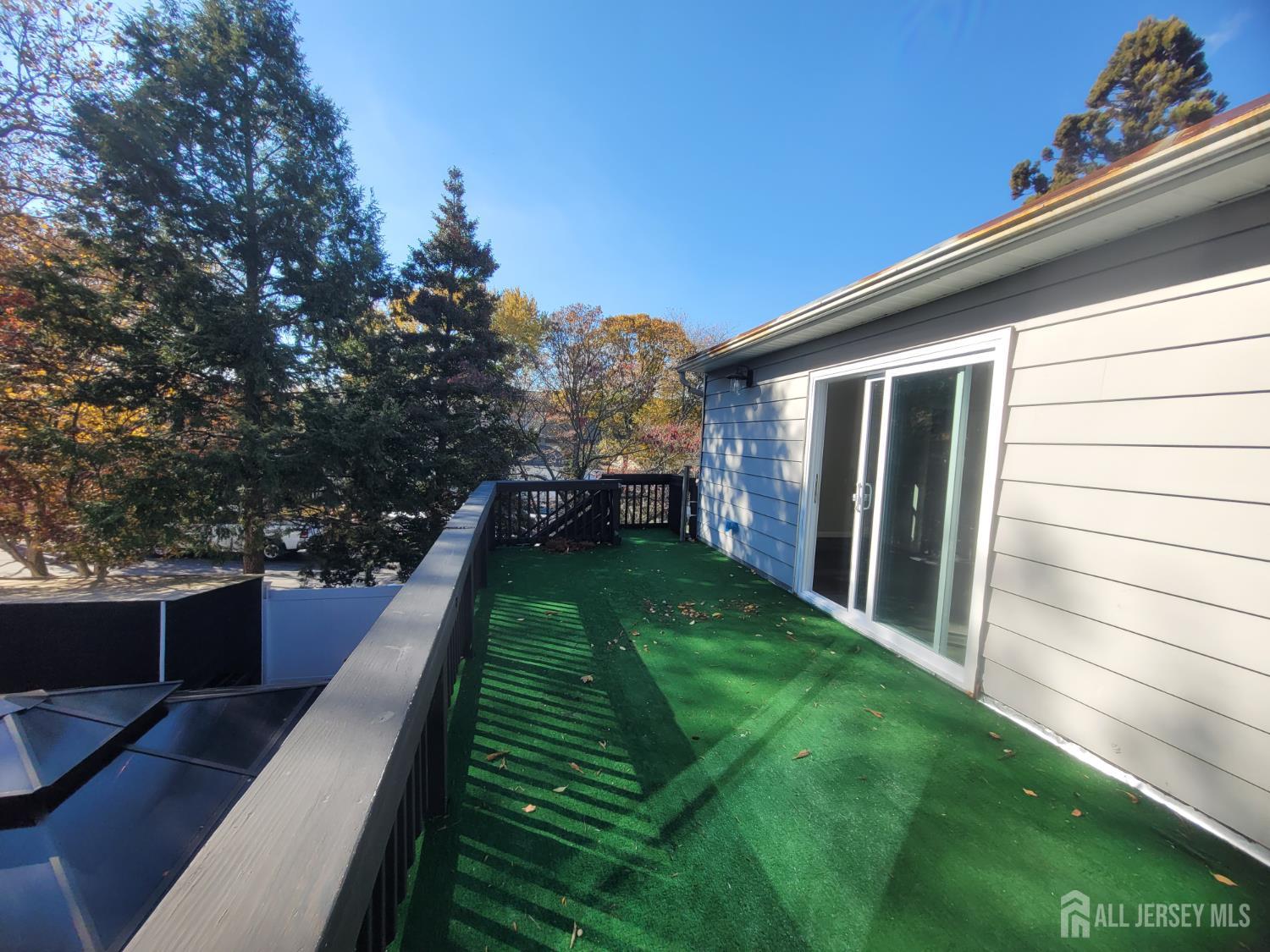 249 Olsen Street, Unit 2 Sayreville, NJ 08879 - Photo 22 of 24 a backyard of a house with lots of green space