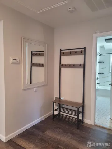 a room with a bench and a window