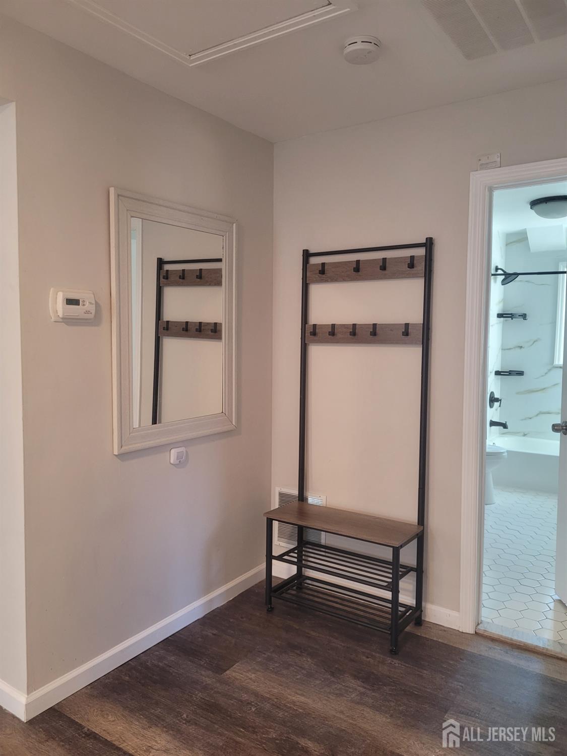 249 Olsen Street, Unit 2 Sayreville, NJ 08879 - Photo 4 of 24 a room with a bench and a window