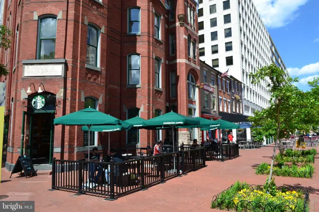 a view of a building with sitting area
